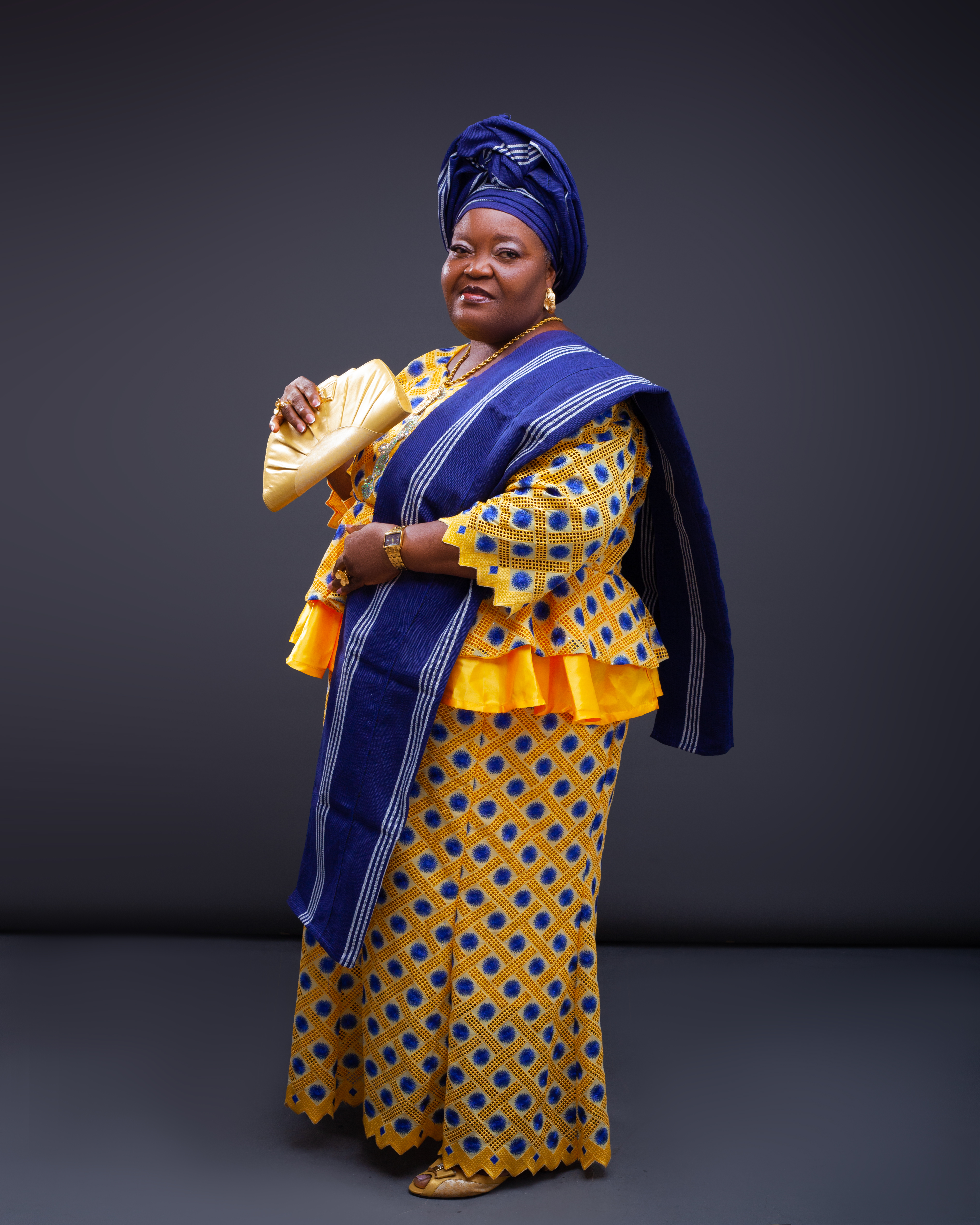 Mrs. Catherine O. Bello Odutayo in elegant blue and gold attire